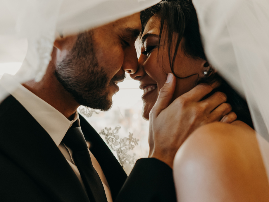 Bride and groom looking at each other at wedding